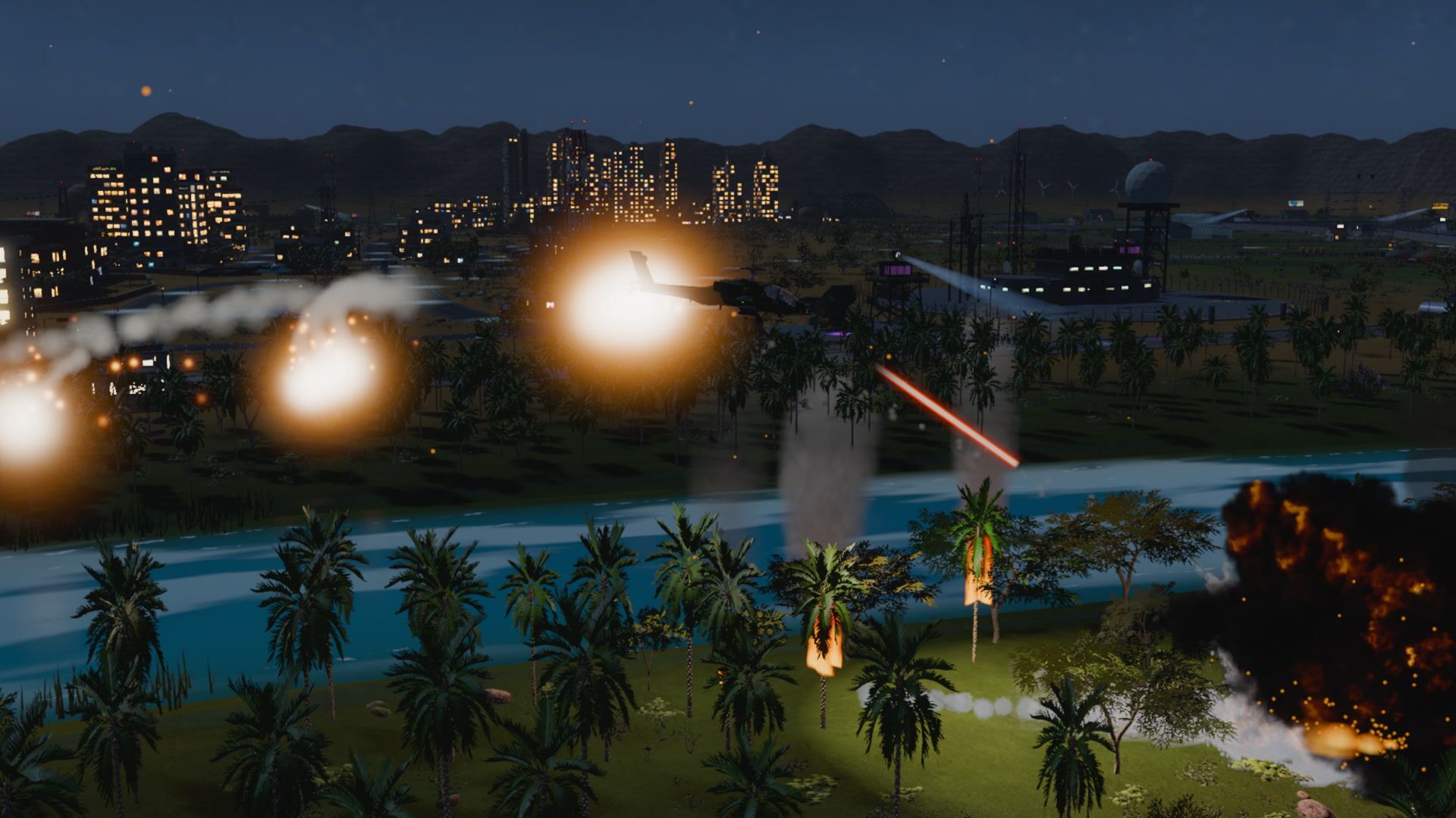A gunship firing over a river town at night, flares and tracer in the dark